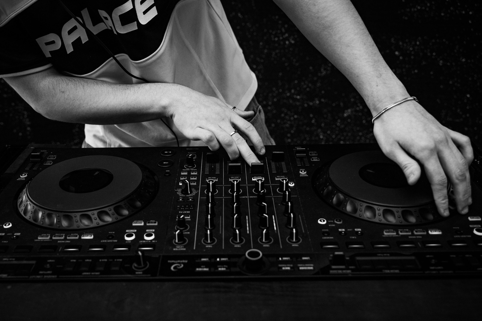 DJ mixing at club decks